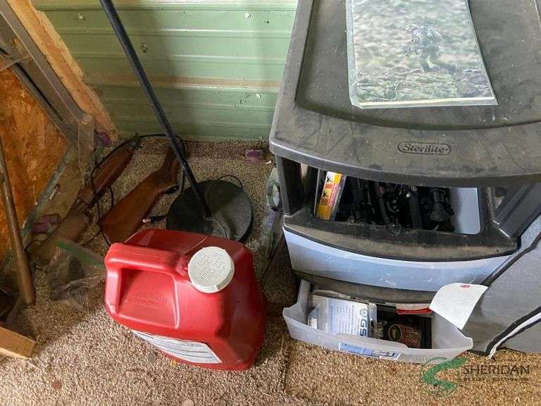 Bin with numerous scopes and other accessories and parts image