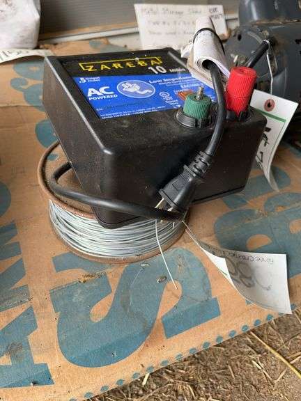 Electric fence charger & (1) spool of electric fence wire, bldg:green image