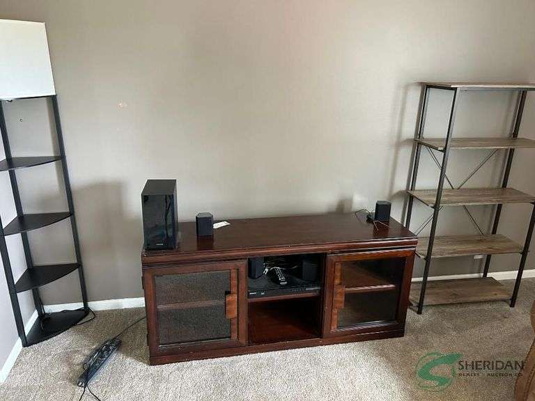 Entertainment center with 2 shelves and contents image