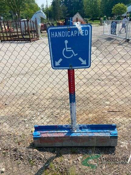 Handicapped parking sign on base image