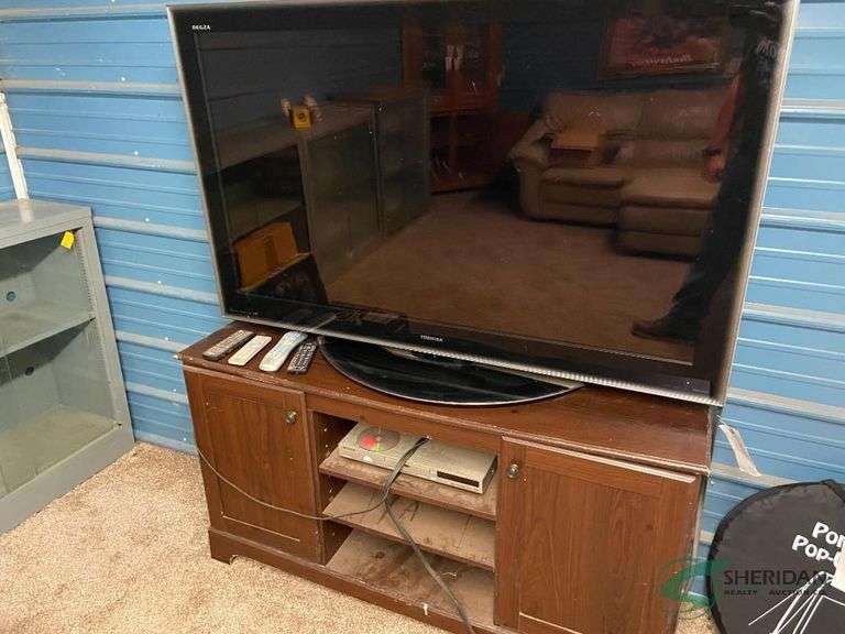52" TV with stand and contents image
