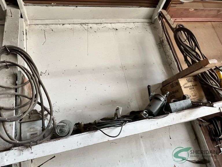 Contents on shelf, includes Wilton Vise and tool box image