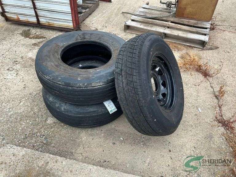 (2) implement tires and (1) tire on rim image