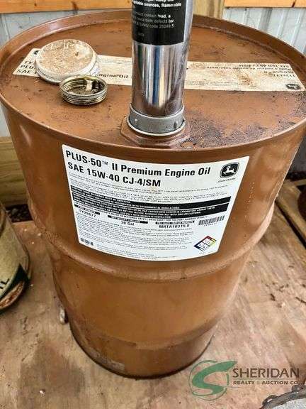 John Deere 15W-40 Oil barrel with pump, partially full image