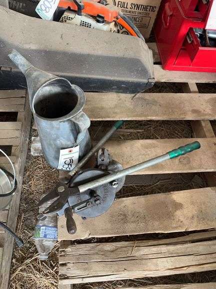 Antique hand grinder, antique oil container, & lopper bldg:Green image