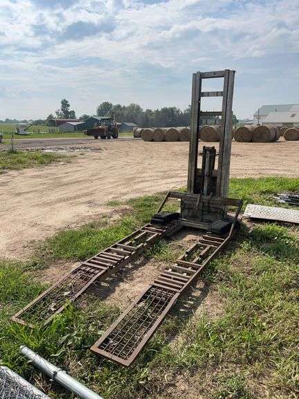 Electric fork truck converted into lawn mower lift, row:6 image