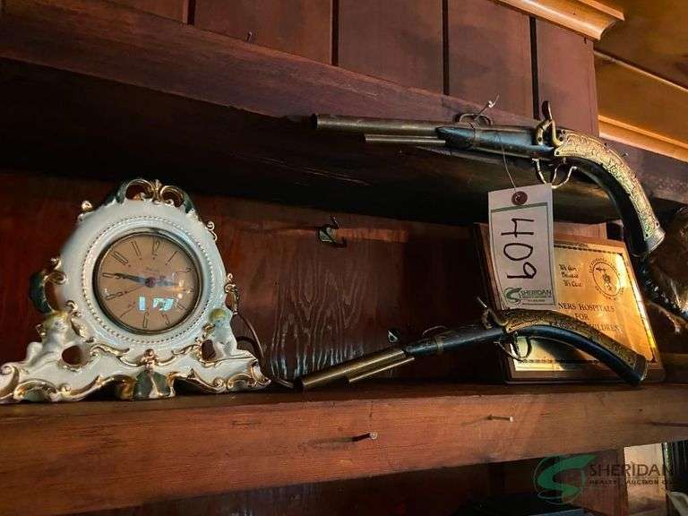 Mantle clock and 2 decorative fake irons image