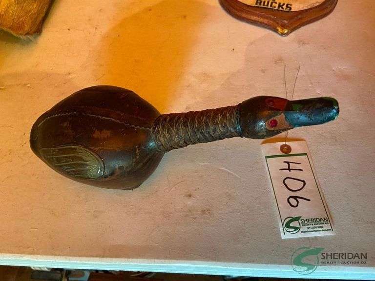 Leather wrapped liquor bottle shaped like a duck image