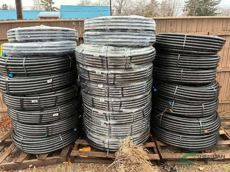 Numerous new rolls of 1" irrigation pipe image