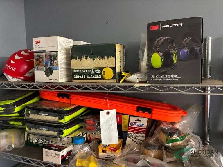 Contents of top 2 shelves chain saw safety equipment image