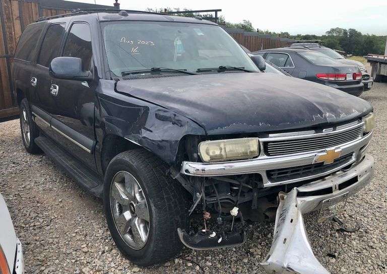 2004 Chevy Suburban - wrecked in the front * i have the key, motor runs good * front tire is messed up * north carolina title