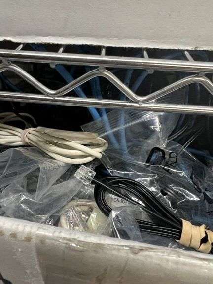 Box of Battery Backups & Radio Chargers, Box Of Plantronics Headsets, Soldering Gun, 2 Docking Stations, Monitor Stand, Monitors, Box of Power Cords, Box of Misc. Electronic Cables, HP Scanjet 3970, Working Condition Unknown