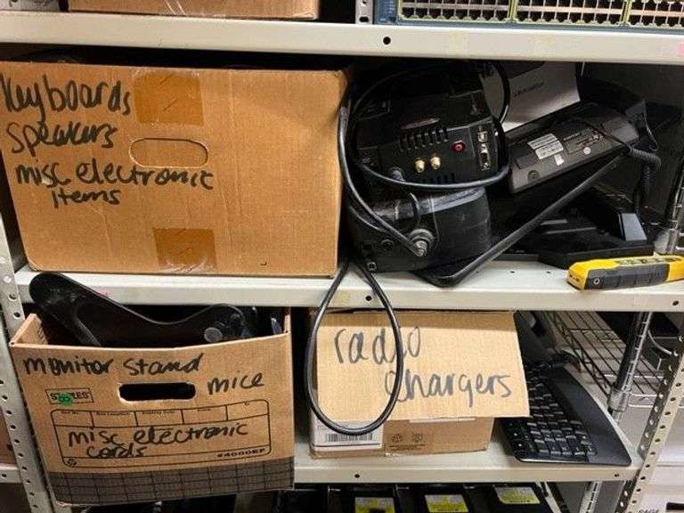 Box of Keyboards, Speakers, Misc. Electronic Items, Apc Battery Backups, Fortinet Phone, Docking Station, Kline Probe Pro Vdv 500-123, Box of Radio Chargers, Box of Misc. Electronics, Mice & Cords, Working Condition Unknown