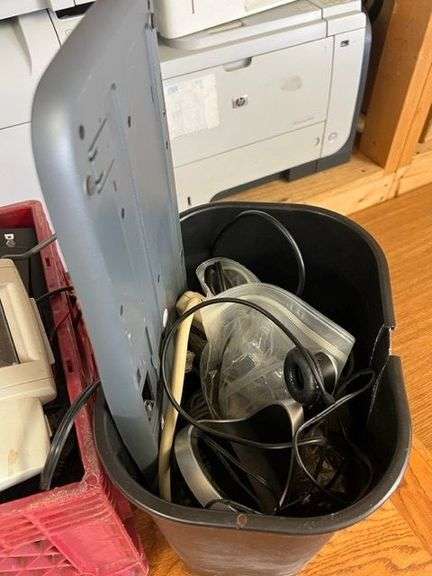 Desk, Computer Bag, Ink Cartridges, Box of Misc. Cords, Netgear Pro Safe JGS524pe 24-Port Switch, 2 APC Battery Backups, 3 Monitors, TV Tray, Milk Crate Full of Electronic Items, Trash Can with Misc. Items, Box of Hanging Folders, Working Condition Unknown