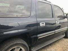 2004 Chevy Suburban - wrecked in the front * i have the key, motor runs good * front tire is messed up * north carolina title