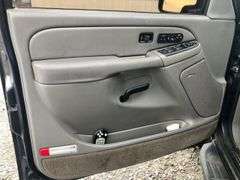 2004 Chevy Suburban - wrecked in the front * i have the key, motor runs good * front tire is messed up * north carolina title