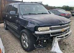 2004 Chevy Suburban - wrecked in the front * i have the key, motor runs good * front tire is messed up * north carolina title