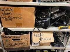 Box of Keyboards, Speakers, Misc. Electronic Items, Apc Battery Backups, Fortinet Phone, Docking Station, Kline Probe Pro Vdv 500-123, Box of Radio Chargers, Box of Misc. Electronics, Mice & Cords, Working Condition Unknown