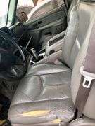 2004 Chevy Suburban - wrecked in the front * i have the key, motor runs good * front tire is messed up * north carolina title
