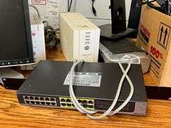 Desk, Computer Bag, Ink Cartridges, Box of Misc. Cords, Netgear Pro Safe JGS524pe 24-Port Switch, 2 APC Battery Backups, 3 Monitors, TV Tray, Milk Crate Full of Electronic Items, Trash Can with Misc. Items, Box of Hanging Folders, Working Condition Unknown