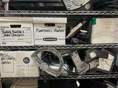 Box of Battery Backups & Radio Chargers, Box Of Plantronics Headsets, Soldering Gun, 2 Docking Stations, Monitor Stand, Monitors, Box of Power Cords, Box of Misc. Electronic Cables, HP Scanjet 3970, Working Condition Unknown