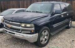 2004 Chevy Suburban - wrecked in the front * i have the key, motor runs good * front tire is messed up * north carolina title