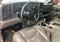 2004 Chevy Suburban - wrecked in the front * i have the key, motor runs good * front tire is messed up * north carolina title