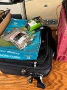 Desk, Computer Bag, Ink Cartridges, Box of Misc. Cords, Netgear Pro Safe JGS524pe 24-Port Switch, 2 APC Battery Backups, 3 Monitors, TV Tray, Milk Crate Full of Electronic Items, Trash Can with Misc. Items, Box of Hanging Folders, Working Condition Unknown