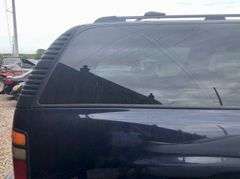 2004 Chevy Suburban - wrecked in the front * i have the key, motor runs good * front tire is messed up * north carolina title