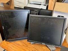 Desk, Computer Bag, Ink Cartridges, Box of Misc. Cords, Netgear Pro Safe JGS524pe 24-Port Switch, 2 APC Battery Backups, 3 Monitors, TV Tray, Milk Crate Full of Electronic Items, Trash Can with Misc. Items, Box of Hanging Folders, Working Condition Unknown