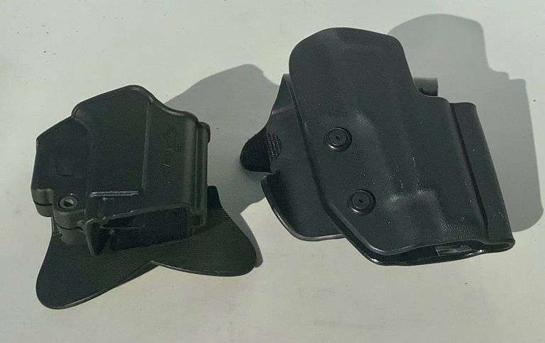2 Black Kydex Paddle Holsters image