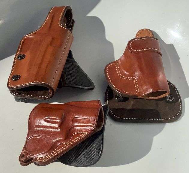 3 Brown Leather Paddle Holsters image