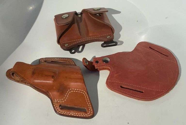 2 Brown Leather Holsters and Magazine Carrier image