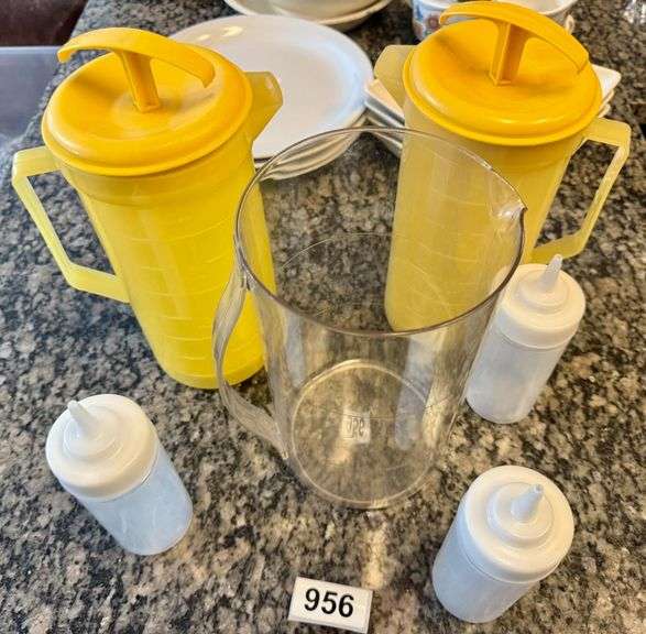 2 Orange Juice Pitchers, 1 Clear Plastic Pitcher, 3 Unused Condiment Squeezers image