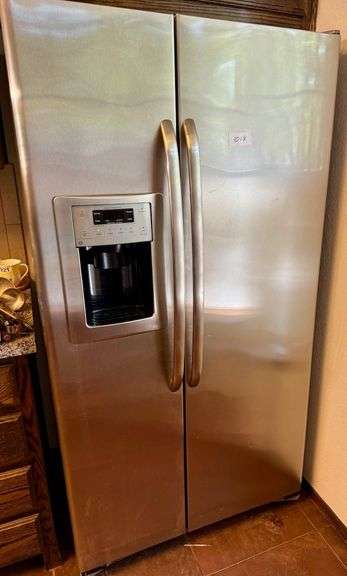 2 Door GE Refrigerator with Broken Water and Ice Maker image