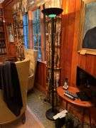 Flat screen TV, tall lamp and side table