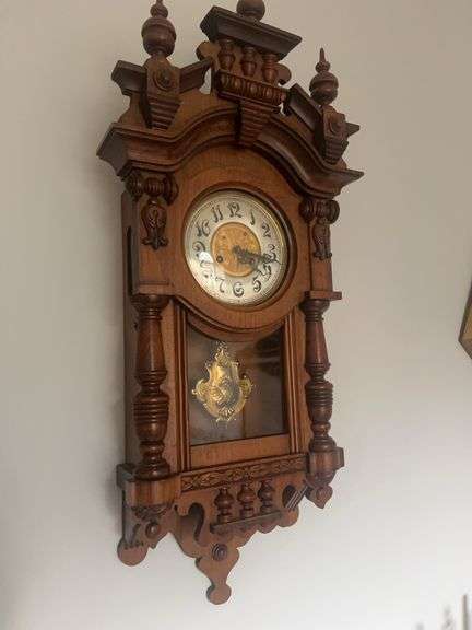 Ornate Wooden Wall Clock with Pendulum image