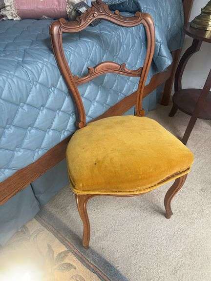 Ornate Carved Wood Chair with Yellow Upholstery image