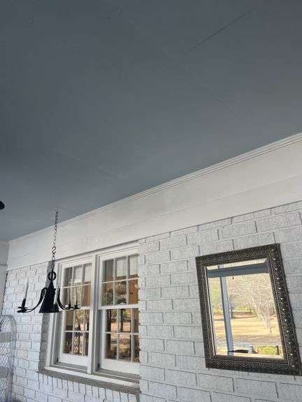 Ornate Framed Mirror and Metal Chandelier image