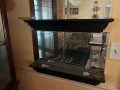 Mirrored wall shelves with contents