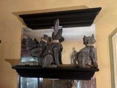 Mirrored wall shelves with contents