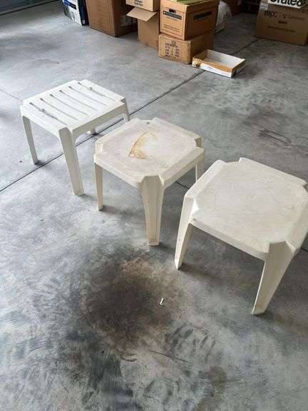 Three plastic end tables