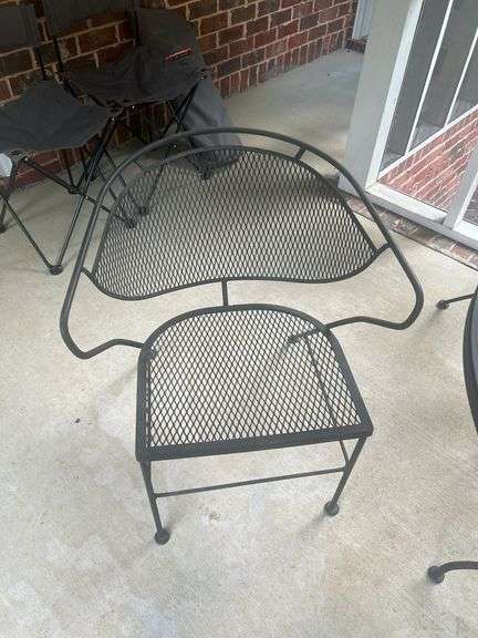 Wrought iron table with four chairs