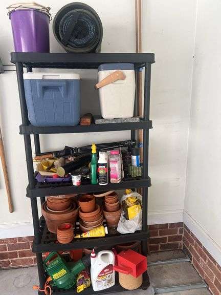 Plastic shelving unit with contents