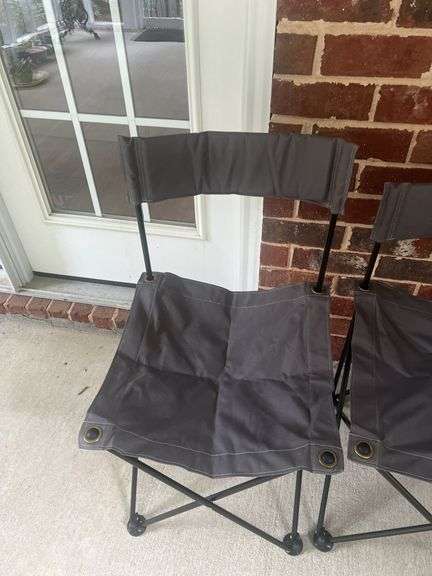Two folding bag chairs in one bag and a sleeping bag.