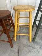 Three wooden barstools
