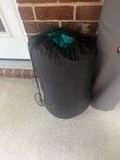 Two folding bag chairs in one bag and a sleeping bag.