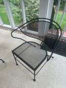 Wrought iron table with four chairs