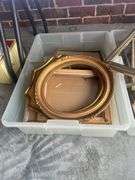 Three plastic containers full of miscellaneous picture frames