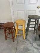 Three wooden barstools